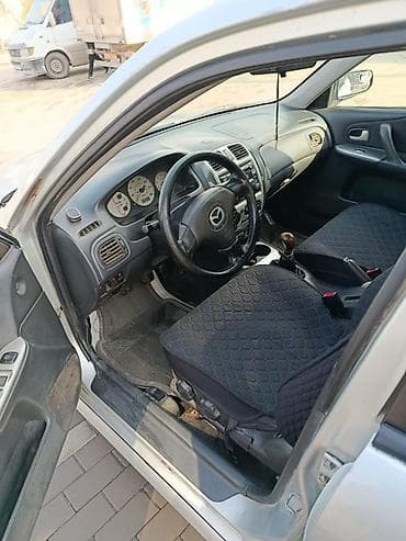 мазда протеж: Mazda 323: 2002 г. — 3