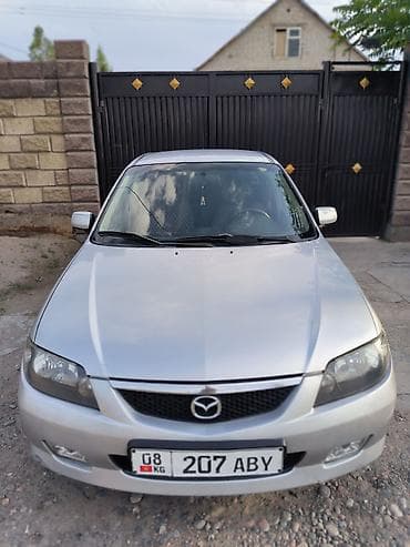 Mazda 323: 2003 г., 2 л, Кол менен иштөөчү, Газ, Хетчбек — 2