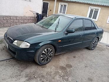 Mazda 323: 2001 г., 1.6 л, Механика, Бензин, Седан
