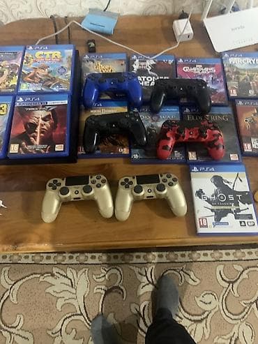 Игровой комплект PlayStation 4 с аксессуарами и коллекцией дисков at lalafo.kg Игровой комплект PlayStation 4 с аксессуарами и коллекцией дисков