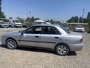 e39 540: Mitsubishi Carisma: 1998 г., Седан — 2