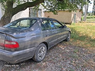 Унаа: Toyota Carina E: 1994 г., Кол менен иштөөчү, Бензин, Седан — 7