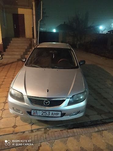 лобовое демио: Mazda 323: 2003 г., 1.6 л, Механика, Хэтчбэк — 9