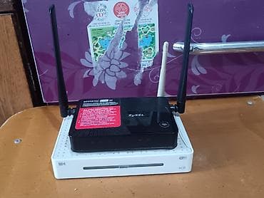 Модемы и сетевое оборудование: Маршрутизатор Zyxel Keenetic Lite III + ТВ-приставка (сетевой — 1