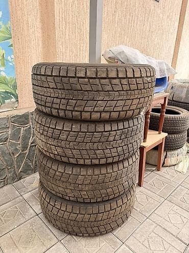 чёрные зимние: Шины 285 / 50 / R 20, Зима, Комплект, Внедорожные (АТ/МТ), DUNLOP — 1