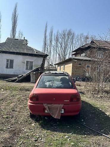 e 303: Mazda 121: 1993 г., 1.3 л, Механика, Бензин, Хэтчбэк — 2