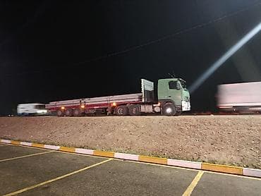 от солнца: Тягач, Volvo, 2001 г., Бортовой — 1