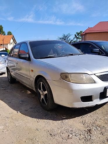 чехол 13 pro: Mazda 323: 2002 г., Механика, Бензин, Хэтчбэк — 1