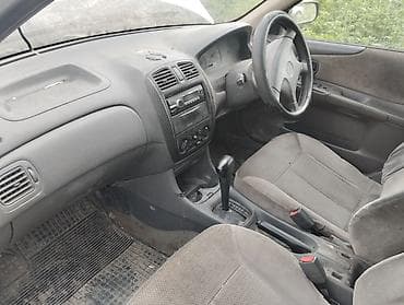 Mazda Familia: 1998 г., Автомат, Бензин, Седан — 4