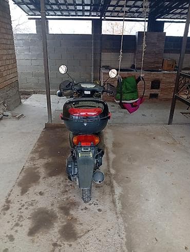 Скутер Honda Dio (серия AF) в тёмном цвете. Характеристики и