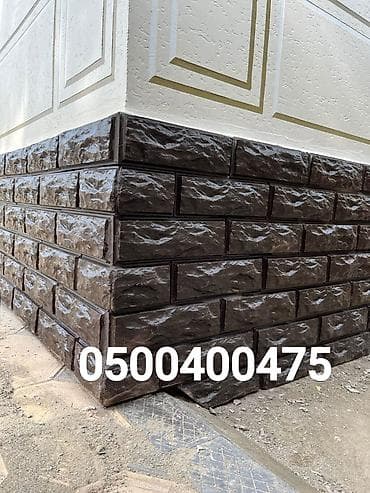 Облицовка фасада и цоколя декоративными панелями “под камень” -