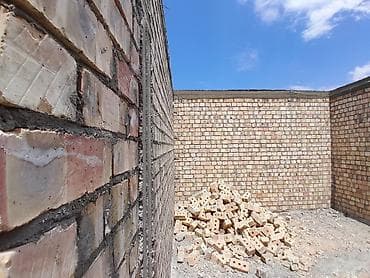 Кладка стен из кирпича. Профессиональные каменщики - Возводим