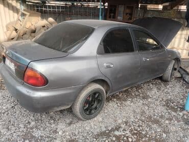 дайво мубира: Mazda 323: 1995 г., 1.5 л, Механика, Бензин, Седан — 2