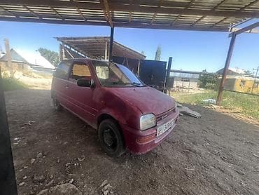 масла прес: Daihatsu Cuore: 1994 г., 0.8 л, Механика, Бензин, Купе — 1