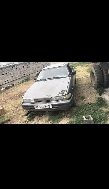 Mazda 626: 1989 г., Кол менен иштөөчү, Бензин, Хетчбек — 1