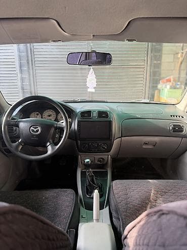 rx 7: Mazda 323: 2002 г., 1.6 л, Механика, Бензин, Хэтчбэк — 6