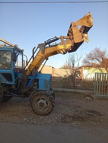 мтз 1222: Фронтальный погрузчик на базе колёсного трактора - Колёсная формула — 3