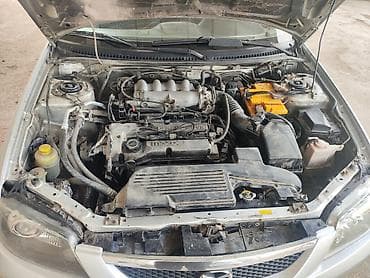 нехсиа 2: Mazda Familia: 2003 г., 1.6 л, Ручные, Бензин, Универсал — 6