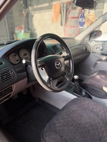 rx 7: Mazda 323: 2002 г., 1.6 л, Механика, Бензин, Хэтчбэк — 5