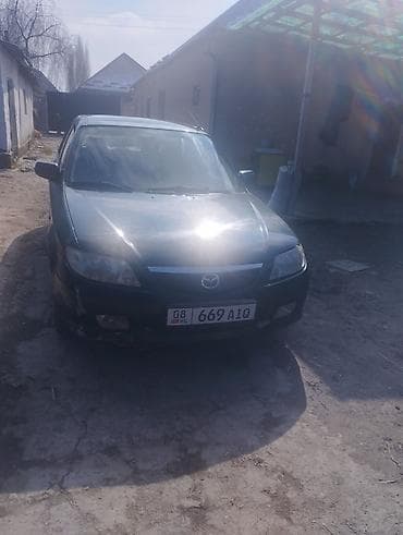 4 5мм: Mazda 323: 2001 г., 1.6 л, Автомат, Бензин, Седан — 2