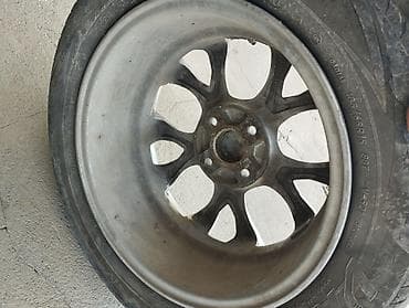 Унаа: Литой диск с шиной R15 - Диаметр диска: 15" - Крепёж: 4 отверстия — 2