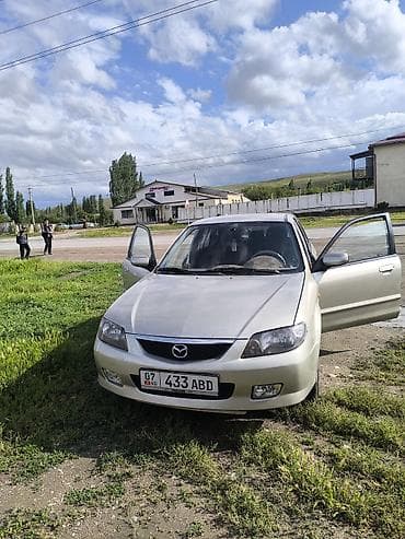 авто сокулук: Mazda 323: 2003 г., 1.6 л, Кол менен иштөөчү, Бензин, Хетчбек — 1