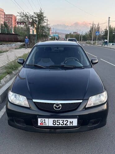 полик нексия 2: Mazda 323: 2002 г., Механика, Универсал — 1