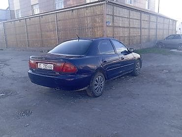lx 470 2007: Mazda 323: 1996 г., 1.5 л, Механика, Бензин, Седан — 3