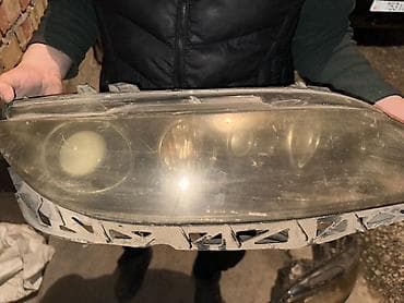 Стоп-сигналы: Передняя левая фара Mazda Оригинал — 1