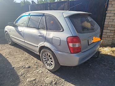 235 60 р18: Mazda 323: 2003 г., 1.6 л, Механика, Бензин, Универсал — 3