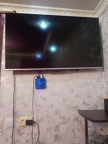 Телевизоры: Телевизор TCL с диагональю около 43–50" (тонкая рамка, нижняя планка — 2