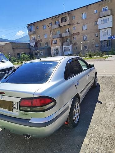 s class w220: Mazda 626: 1999 г., 1.8 л, Механика, Бензин, Хэтчбэк — 4