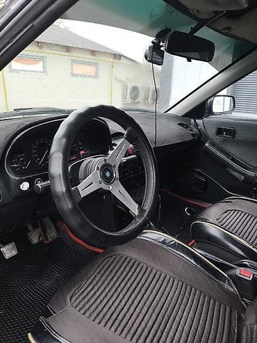 belarus mtz: Mazda 323: 1991 г., 1.8 л, Механика, Бензин, Хэтчбэк — 6