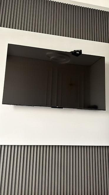 Телевизор с настенным креплением - Плоская панель большого