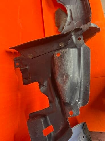 гофрированная бумага купить: Черный пластиковый подкрылок для автомобиля. Имеет изогнутую форму — 6