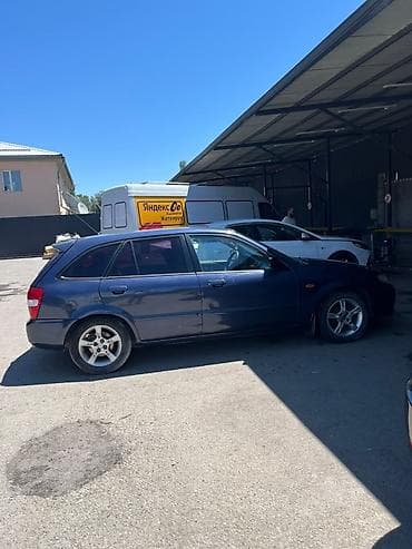 Транспорт: Mazda 323: 2002 г., 1.6 л, Механика, Бензин, Хэтчбэк — 2