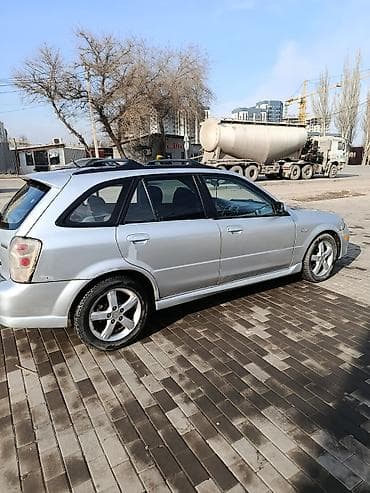 65 style: Mazda Protege: 2003 г., 2 л, Механика, Бензин, Универсал — 1