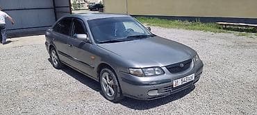 Транспорт: Mazda 626 седан, серый металлик Основные характеристики: - Кузов — 1