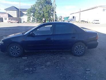 lx 470 2007: Mazda 323: 1996 г., 1.5 л, Механика, Бензин, Седан — 7