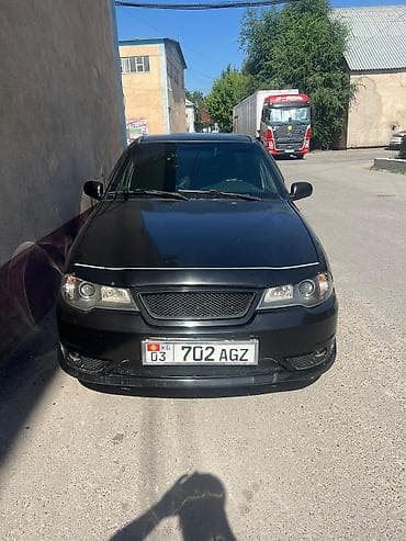 Автомобиль седан, черный цвет, киргизская регистрация (номерной знак