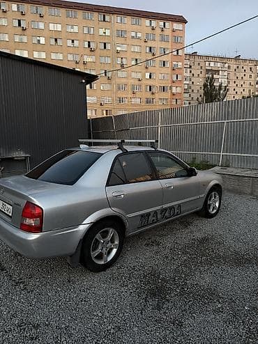 pes 2013: Mazda 323: 2003 г., 1.6 л, Механика, Бензин, Седан — 4