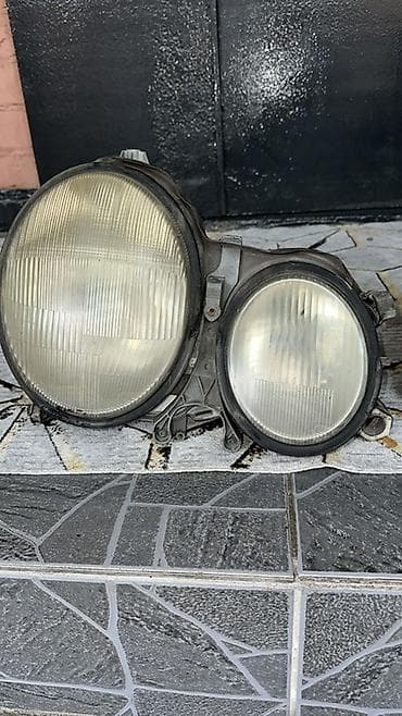 шторка w210: Передняя левая фара Mercedes-Benz — 1