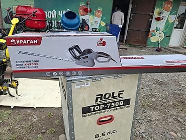 секатор: Электрический кусторез Ураган PROtech - Мощность: 900 Вт (указано на — 1