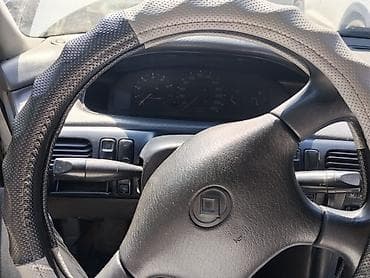колпачки: Mazda Cronos: 1992 г., 2 л, Механика, Бензин, Седан — 7