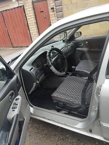 Скупка авто: Mazda 323: 2003 г., Механика, Бензин, Универсал — 1