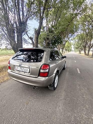 step wgn: Mazda 323: 1999 г., 1.6 л, Механика, Бензин, Универсал — 4