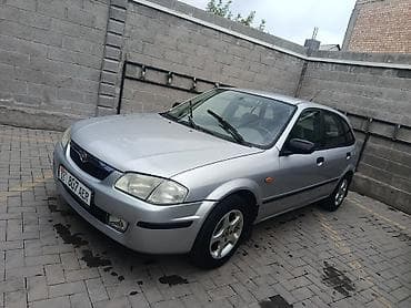 бакту долонотуу: Mazda 323: 2000 г., 1.5 л, Кол менен иштөөчү, Бензин, Хетчбек — 3