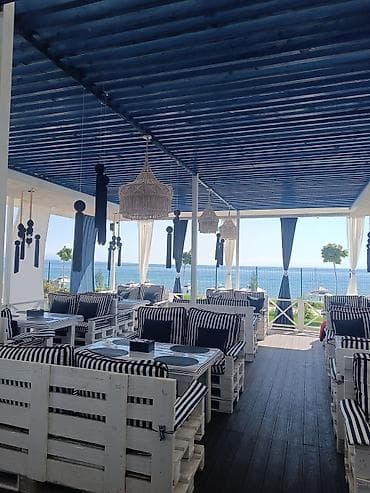 Лаунж-зона/кафе у моря с панорамным видом. - Просторная открытая at lalafo.kg Лаунж-зона/кафе у моря с панорамным видом. - Просторная открытая