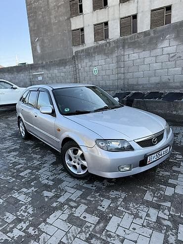 w210 e280: Mazda 323: 2003 г., 1.6 л, Механика, Бензин, Универсал — 2