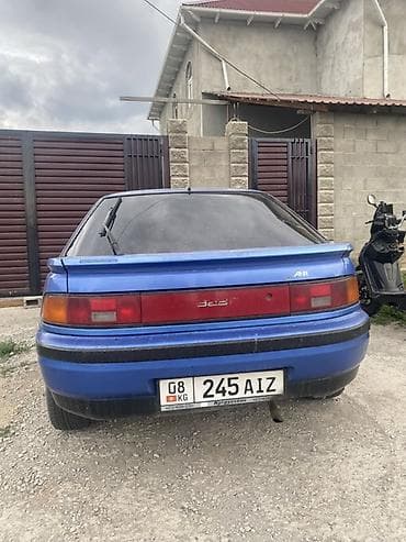 ош жапалак: Mazda 323: 2026 г., Кол менен иштөөчү, Бензин, Хетчбек — 2
